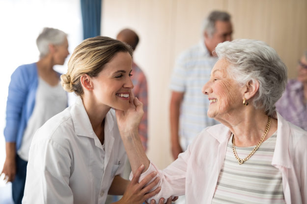 senior woman with nurse at Assisted Living for Seniors