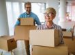 Portrait of happy senior couple in love moving in new home