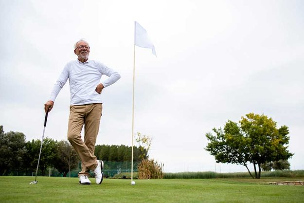 an active senior man playing golf at the golf course and enjoying free time outdoors an active senior man playing golf at the golf course and enjoying free time outdoors