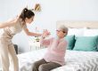 Caregiver mistreating senior woman in nursing home