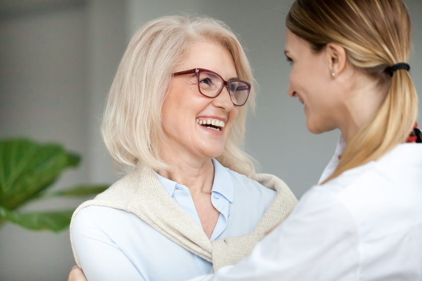 Beautiful happy aged woman embracing young adult daughter and la 3 Ways Retirement Communities In Boca Raton, FL Build Trust And Respect In Residents