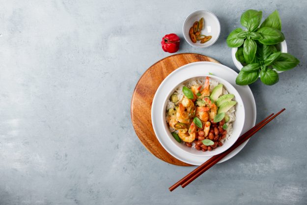 Shrimps in curry sauce and rice Exploring Caribbean Cuisines When Retiring In 55+ Communities In Boca Raton, FL