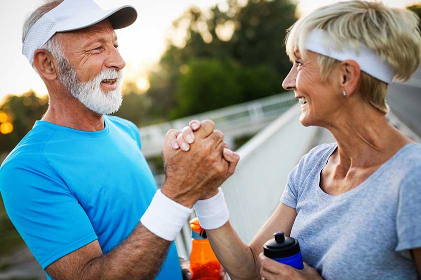 senior-couple-staying-fit-by-exercise-jogging Happy senior couple staying fit by exercise jogging