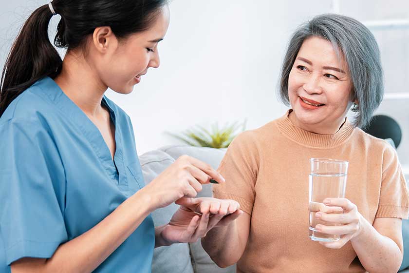 Contented senior woman taking medicines Contented senior woman taking medicines