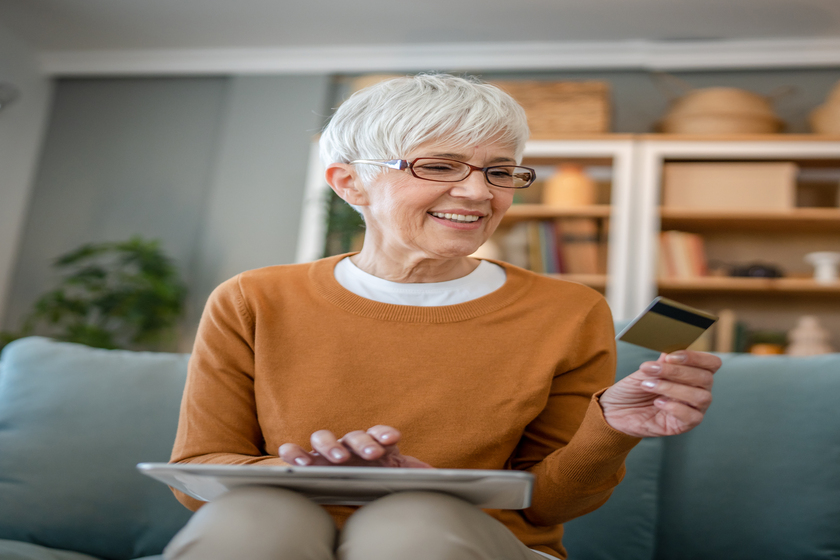 Senior woman caucasian female hold credit card online shopping a Discover The Senior Discounts You Can Get When Staying In Retirement Communities In FL