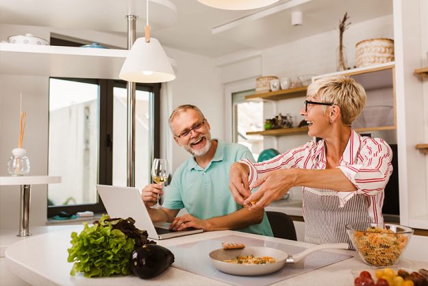 Senior couple preparing food in the kitchen. Senior couple preparing food in the kitchen.
