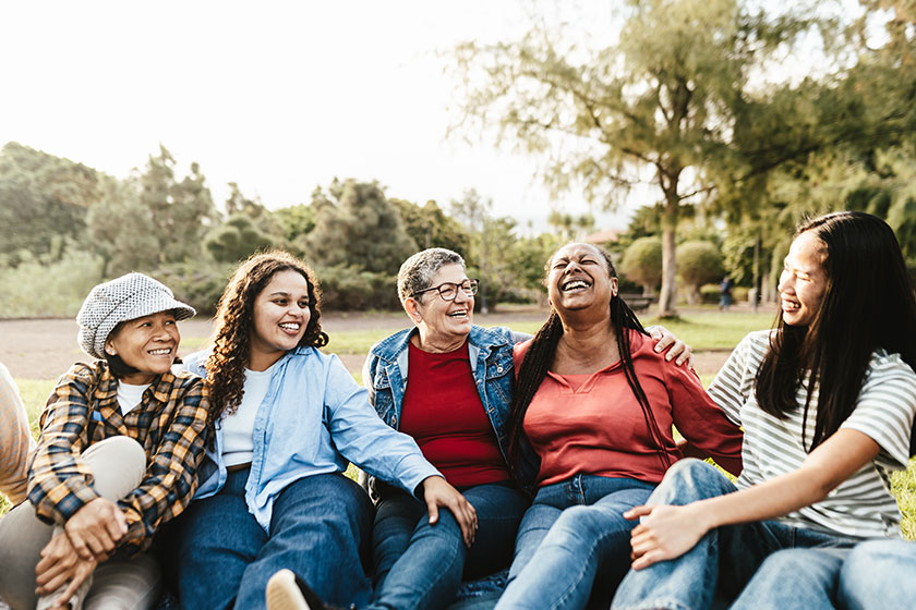 happy multi generational group women different ethnicities having fun sitting