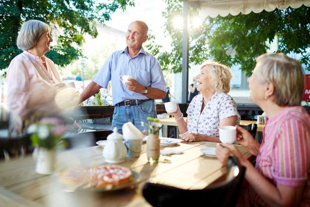 senior friends having tea in cafe senior friends having tea in cafe