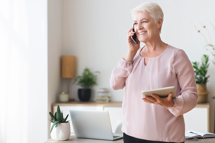 busy old woman consulting client on phone busy old woman consulting client on phone