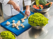 cropped image chef cutting mushrooms