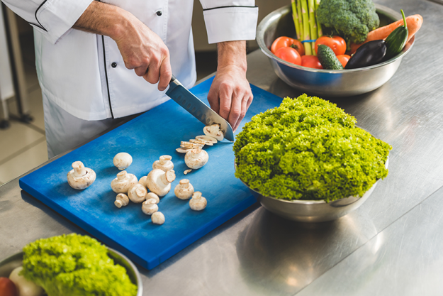 cropped image chef cutting mushrooms cropped image chef cutting mushrooms