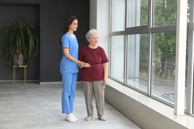 young nurse senior woman holding hands young nurse senior woman holding hands