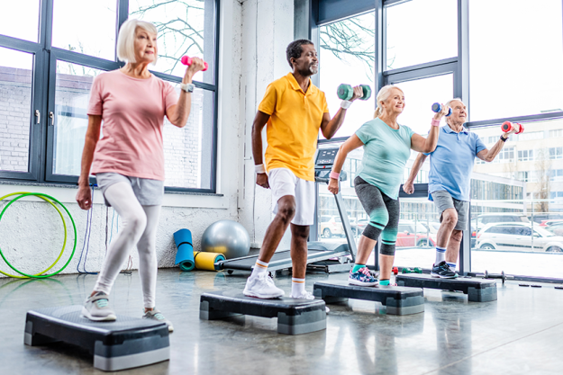 multicultural senior sportspeople synchronous exercising dumbbells multicultural senior sportspeople synchronous exercising dumbbells