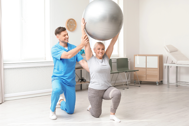 physiotherapist working with patient in clinic rehabilitation physiotherapist working with patient in clinic rehabilitation