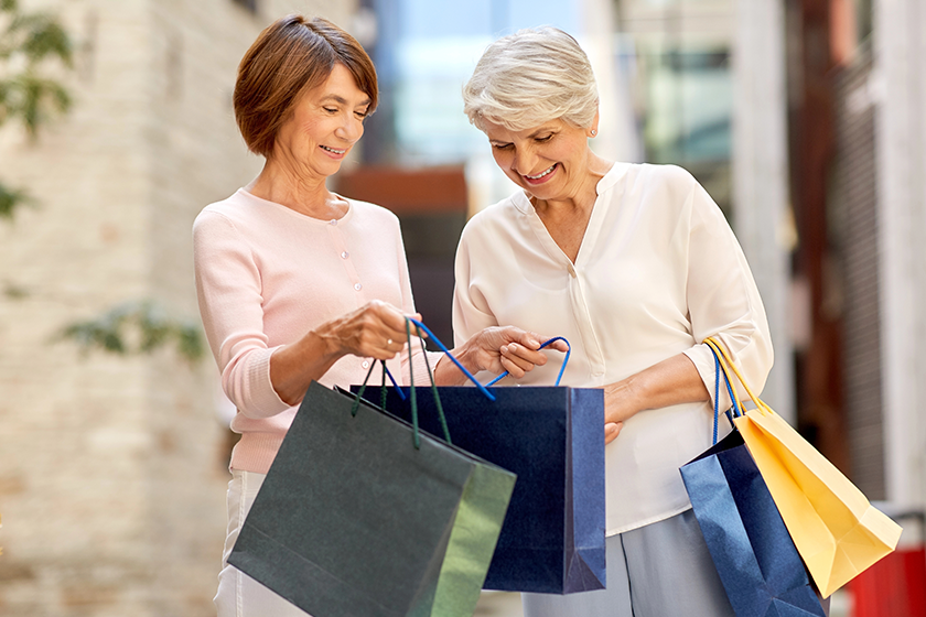 senior women with shopping bags senior women with shopping bags