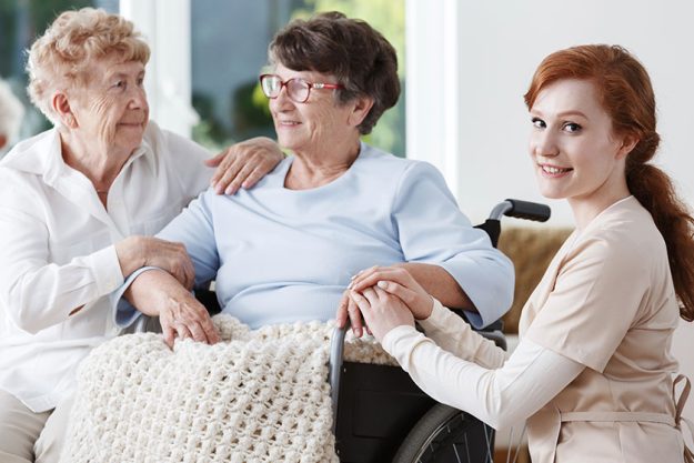 Young woman holding ladys hands Young woman holding ladys hands