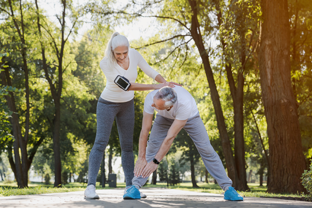 full length active senior couple doing warm exercises full length active senior couple doing warm exercises