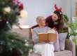 cute young woman holds gift box