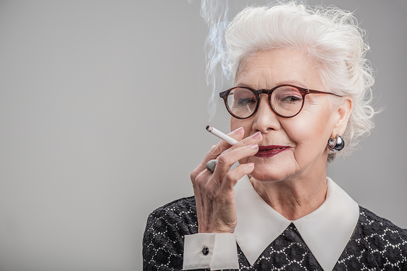 happy aged lady enjoying ciggy