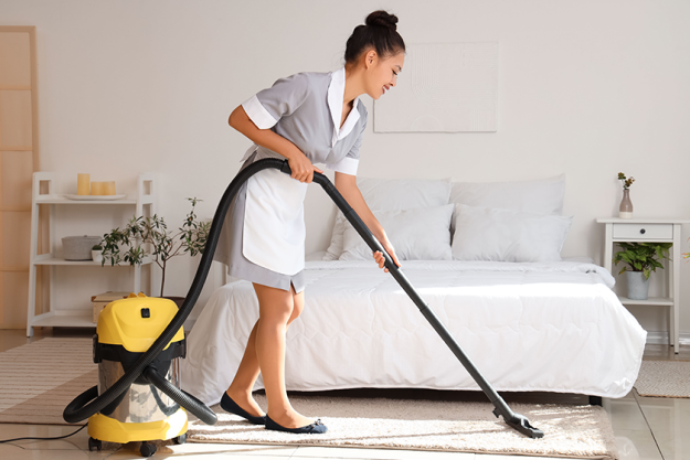 pretty chambermaid cleaning hotel room pretty chambermaid cleaning hotel room