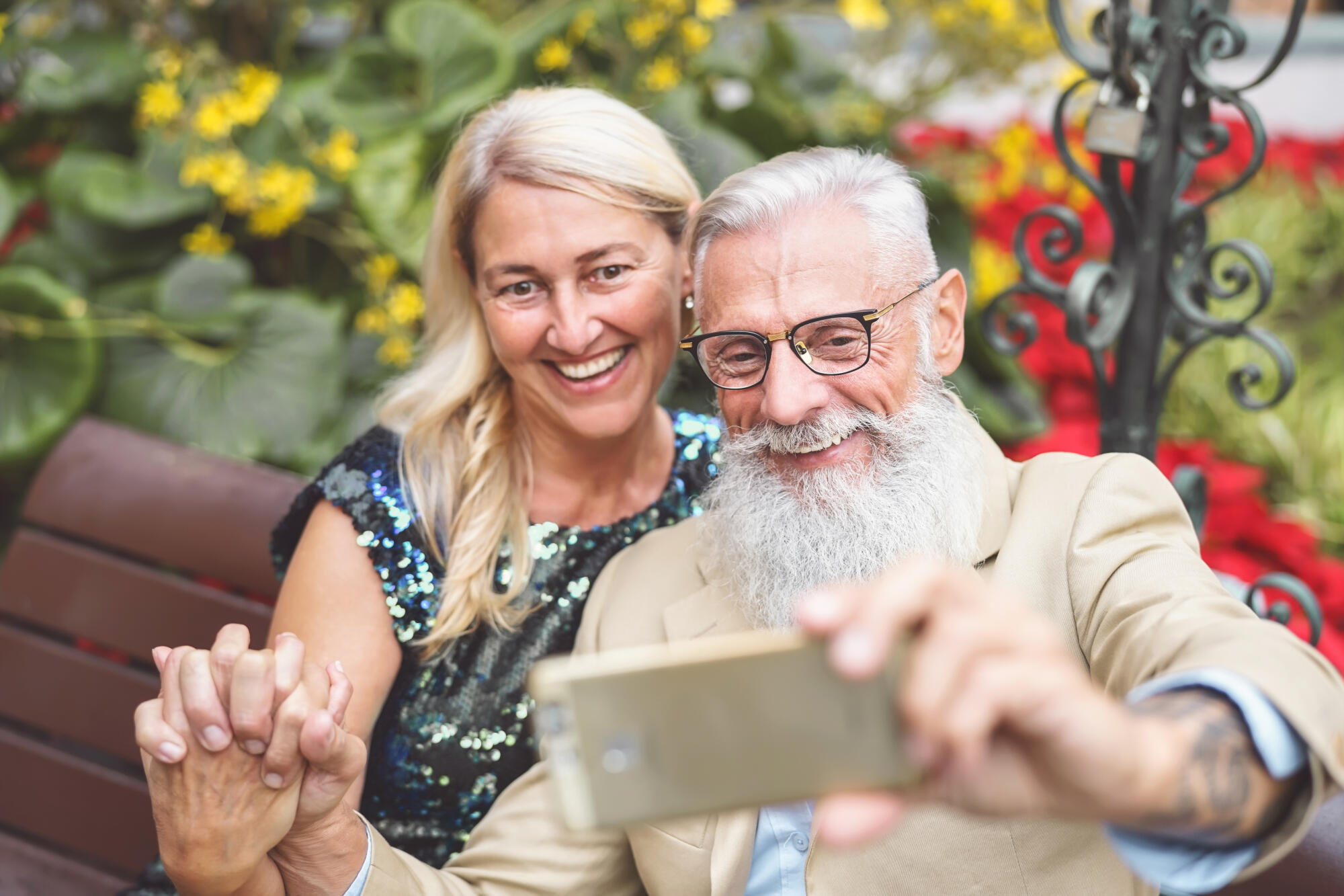 Happy senior couple taking selfie with mobile smart phone outdoo Happy senior couple taking selfie with mobile smart phone outdoo